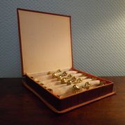 Box of 12 knife holders in silver metal, shape of canrds, 60s