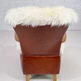 Scandinavian style armchair in leather and hide