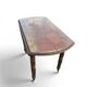 Antique drop-leaf table in wood, with turned legs and castors.