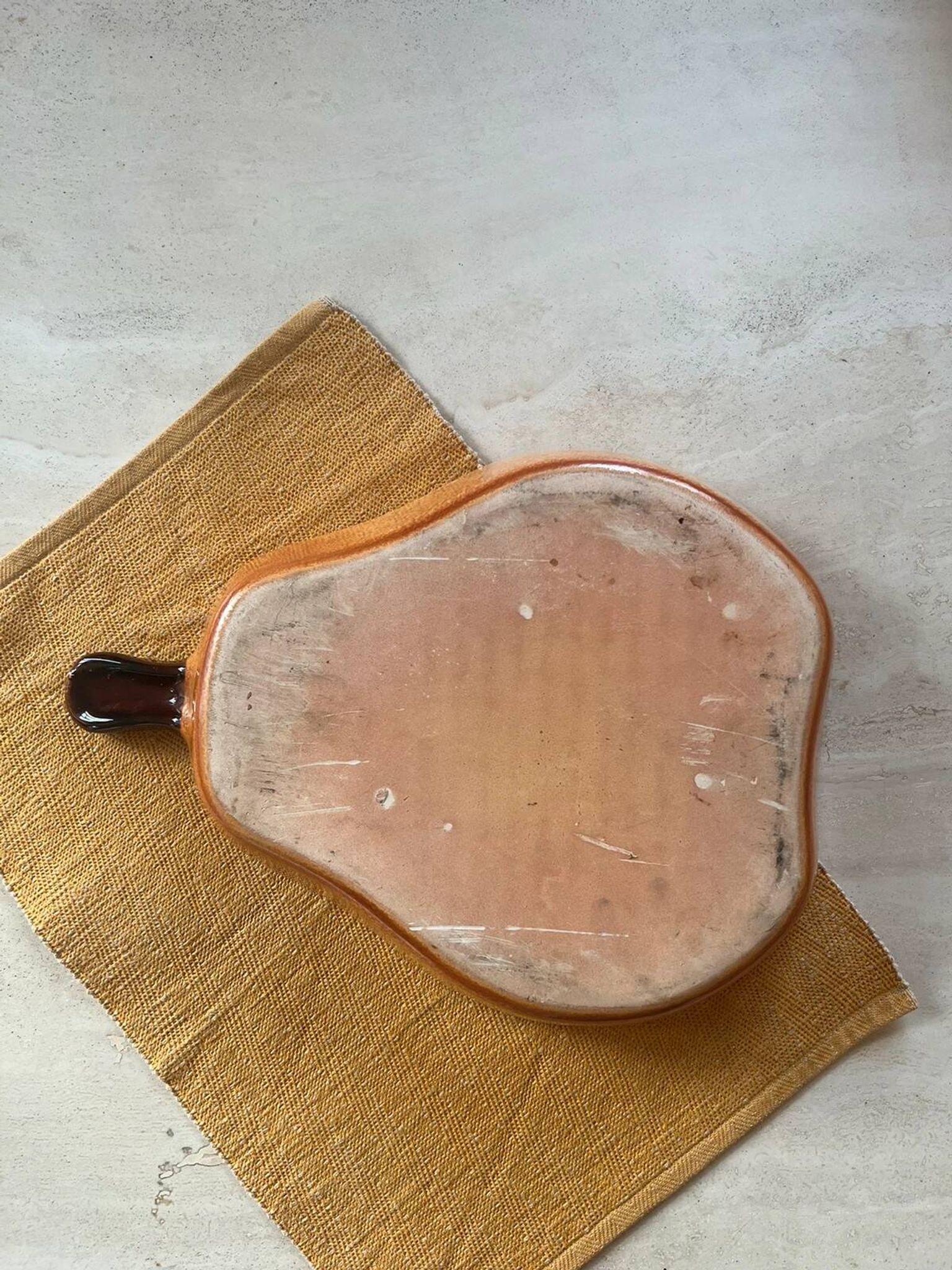 Ceramic dish in the shape of a pear.