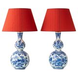 Pair of Royal Delft blue and white ceramic table lamps with new vermilion silk shades.