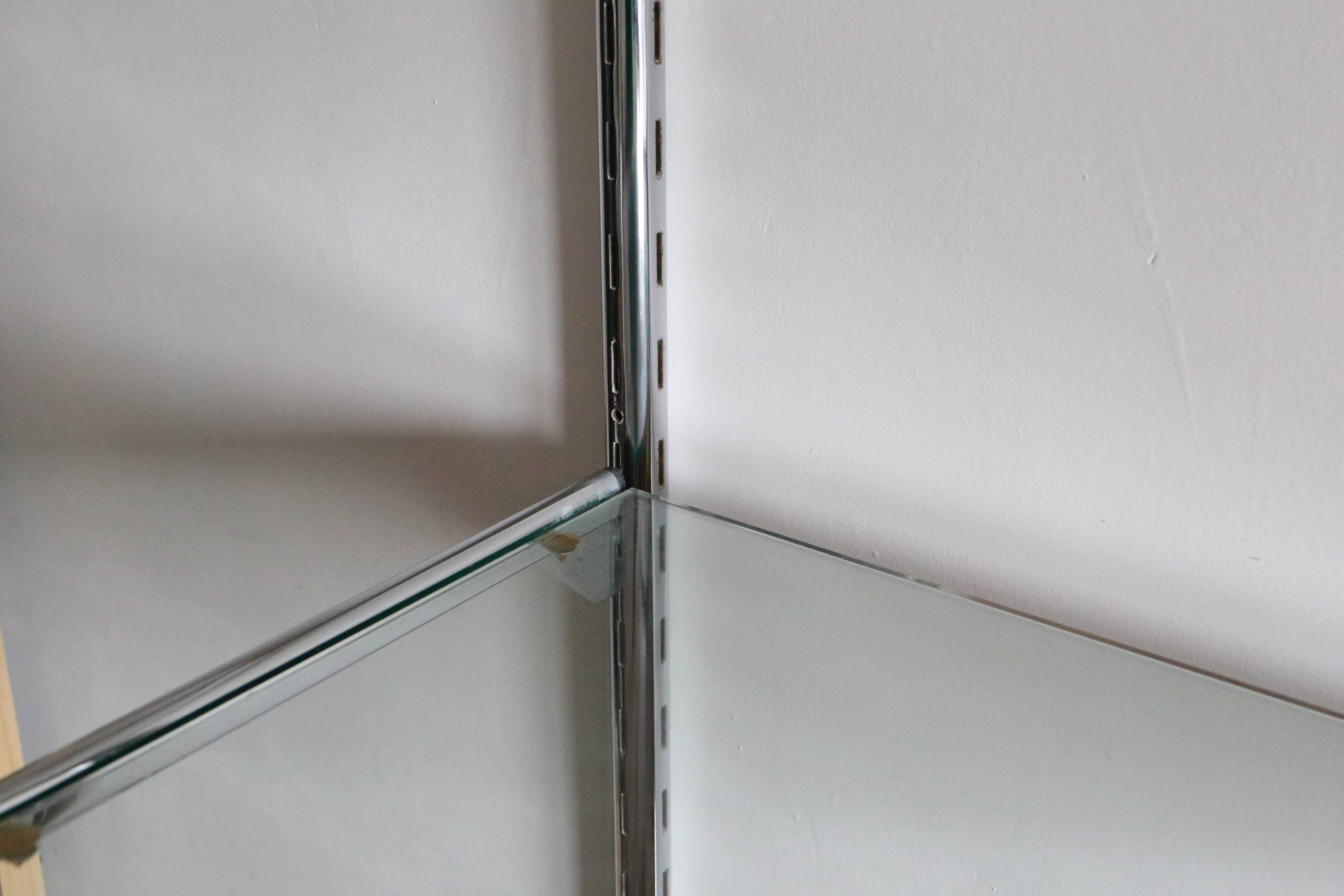 Chrome and glass wall shelf, circa 1960