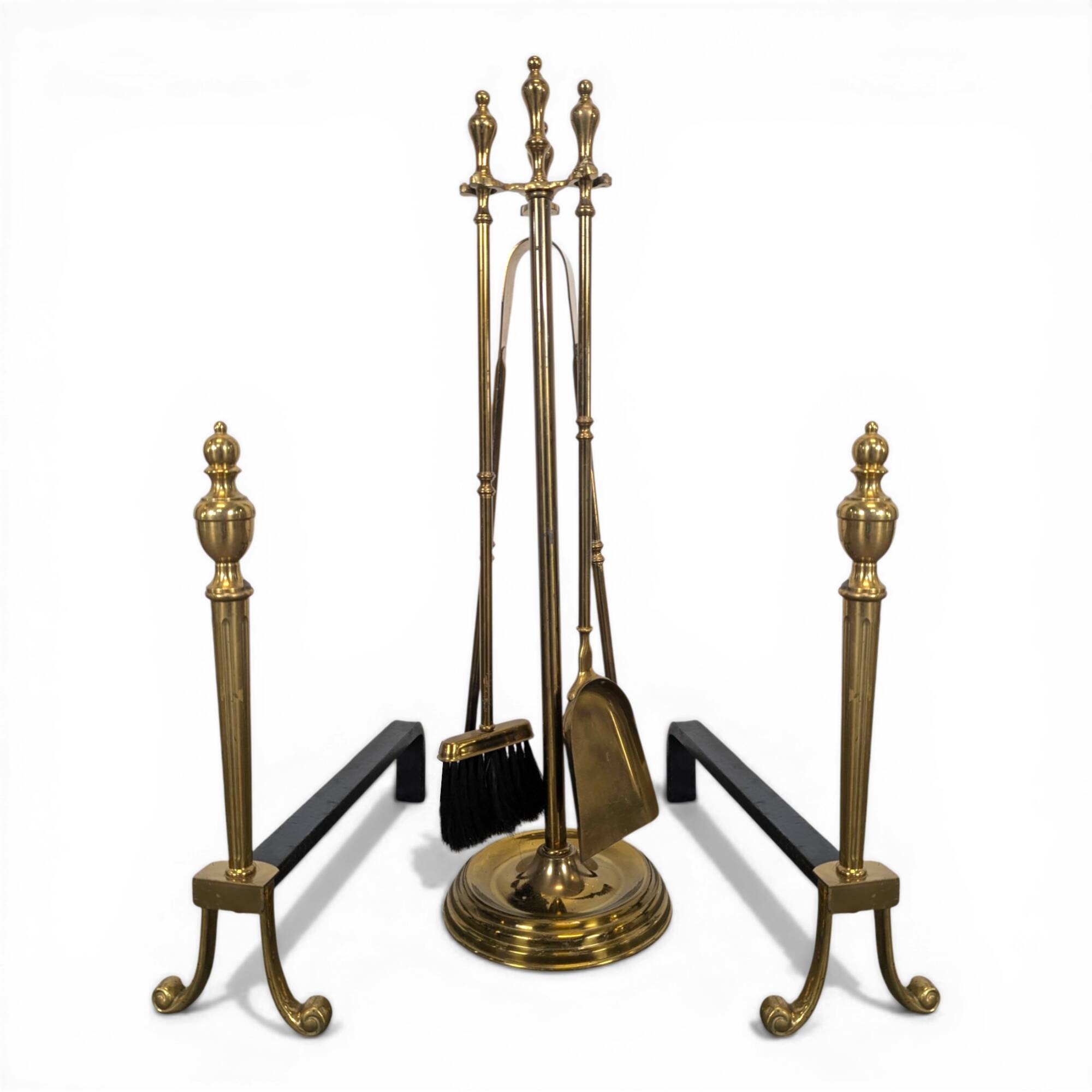 Pair of fire dogs and fireplace tools