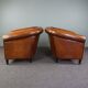 Set of 2 club chairs in black piping sheep leather