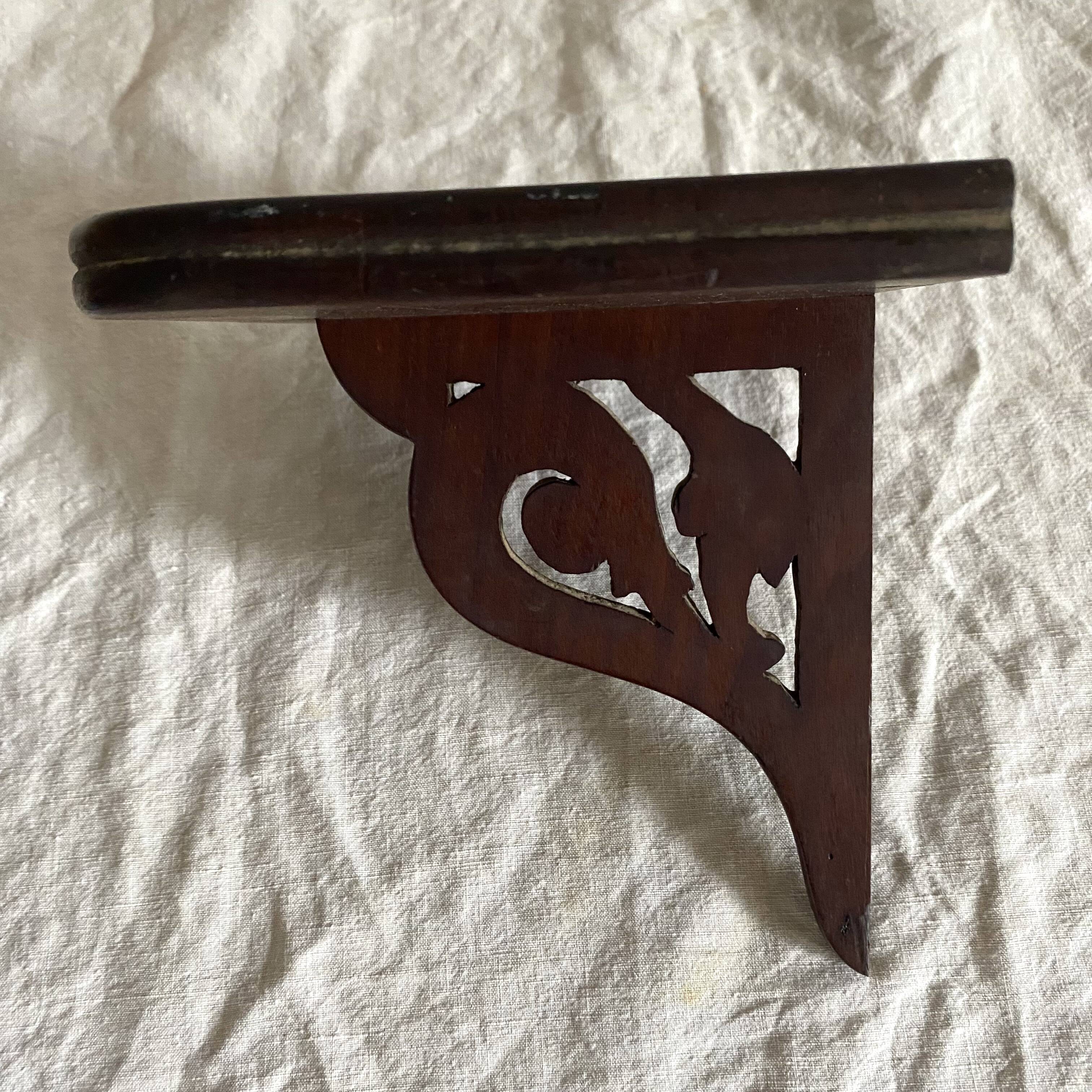 small old openwork wooden wall shelf