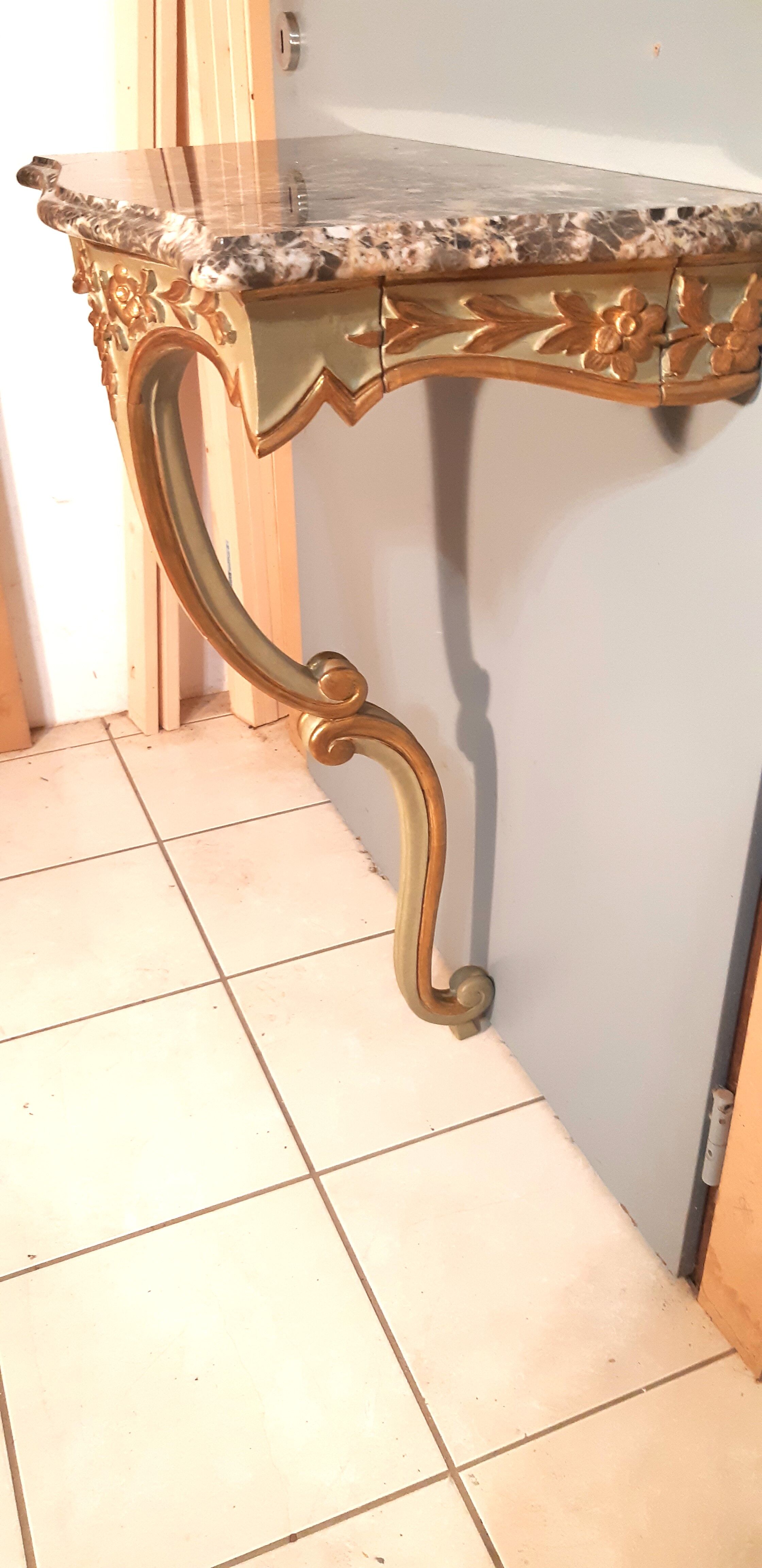 Louis XV style wall lamp console, twentieth century, wood and gilded stucco marble top