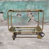 Old rolling coffee table serving vintage brass bar 50s mid-century design