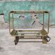 Old rolling coffee table serving vintage brass bar 50s mid-century design