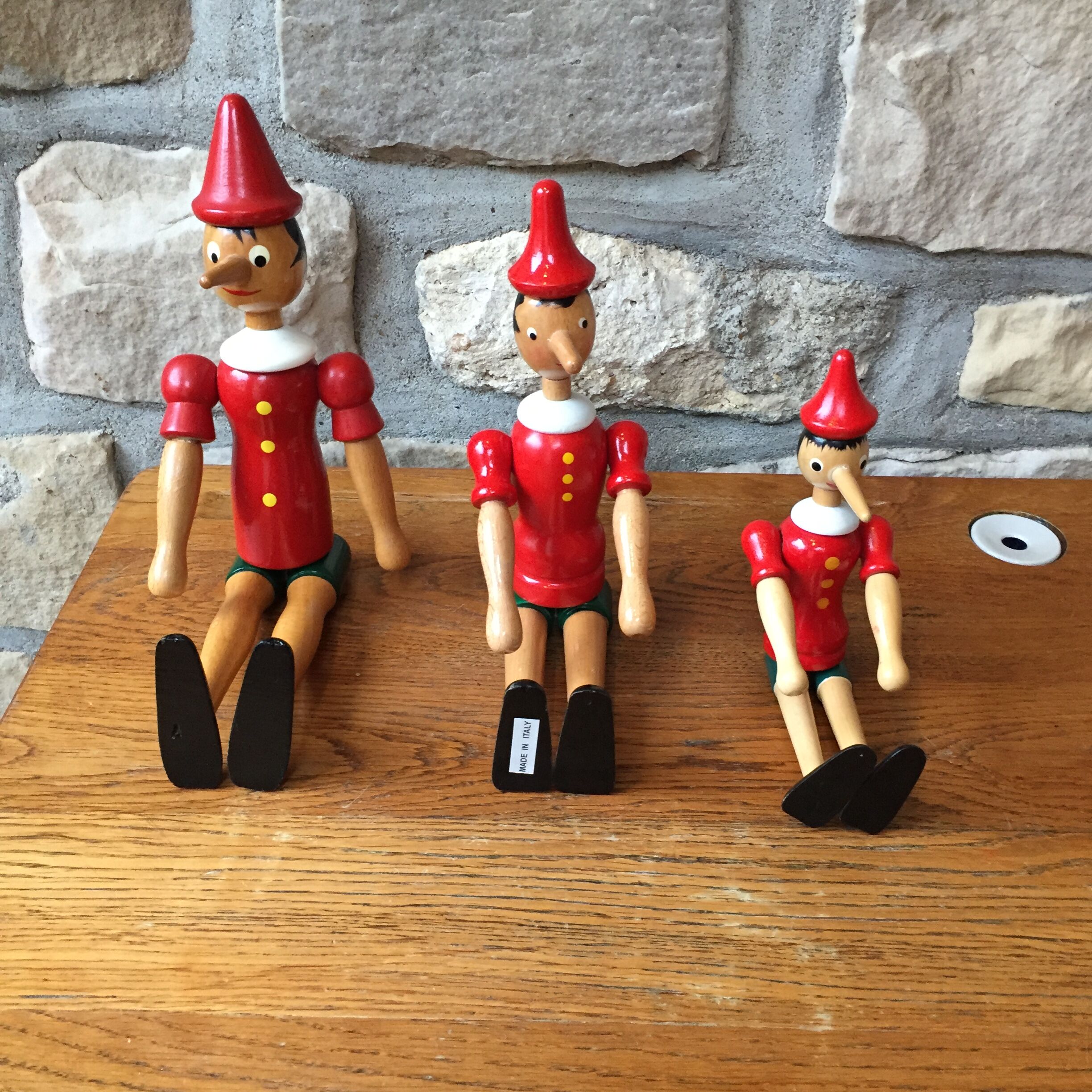 Trio of old wooden Pinocchio Made in Italy
