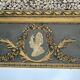 Miroir trumeau à decor d'un médaillon de femme 106cm haut
