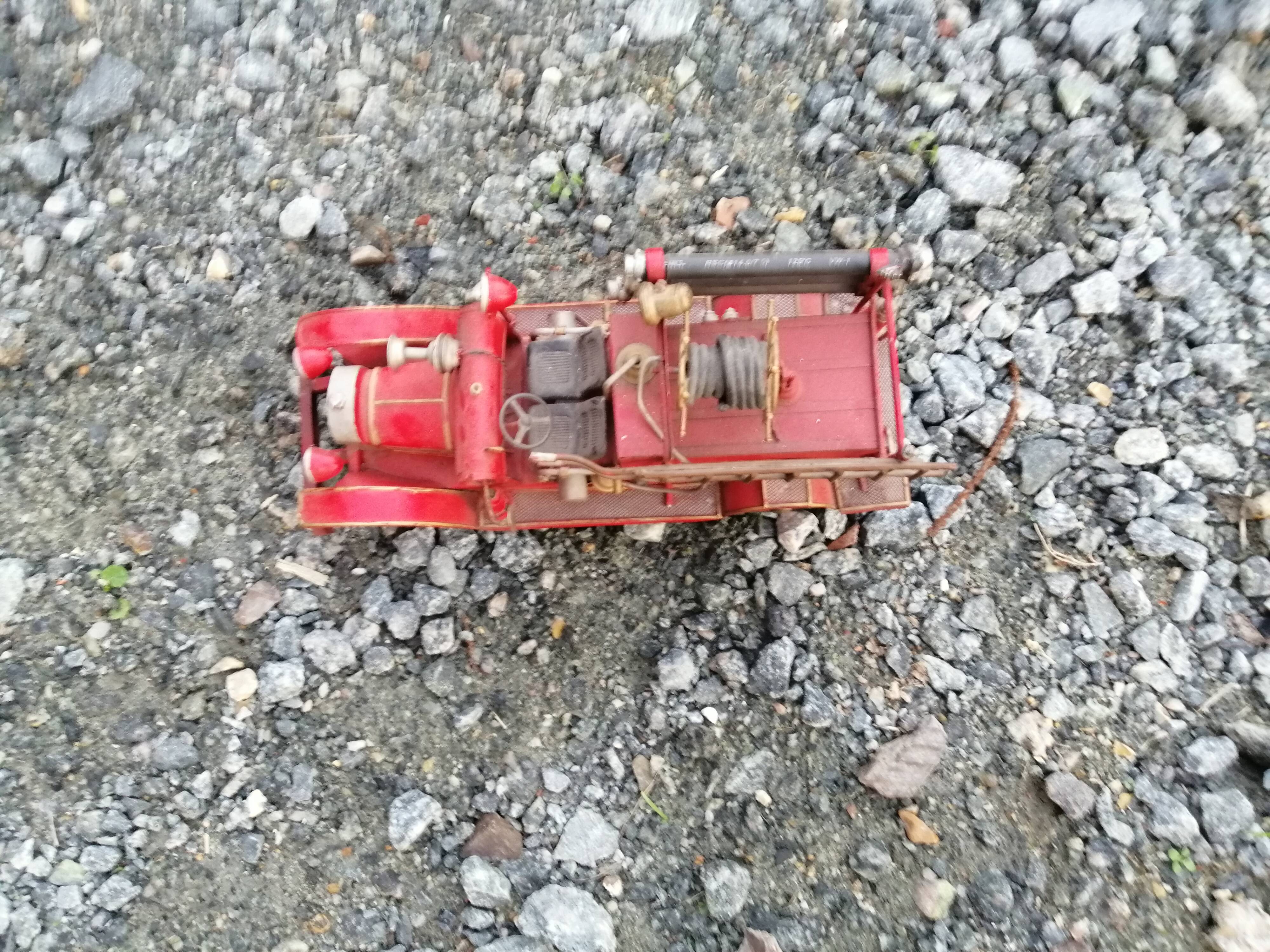 American fire truck from 1930 in sheet steel with all its water lance accessories,