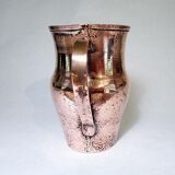 Old pitcher made of tinned copper
