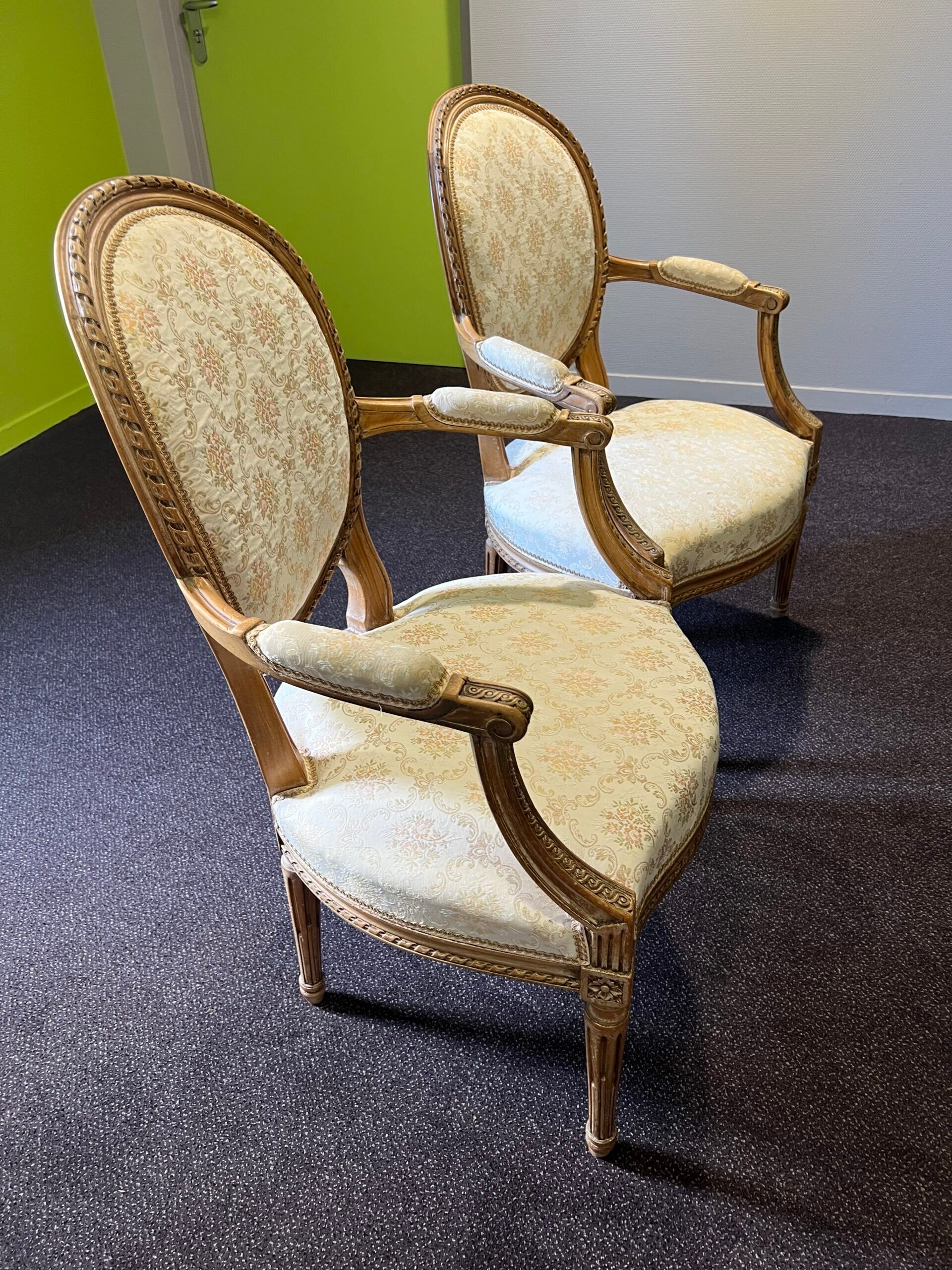Pair of Louis XVI style armchairs, in solid walnut, re-edged and upholstered, pegged