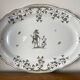 Large earthenware dish from Moustiers, signed Féret