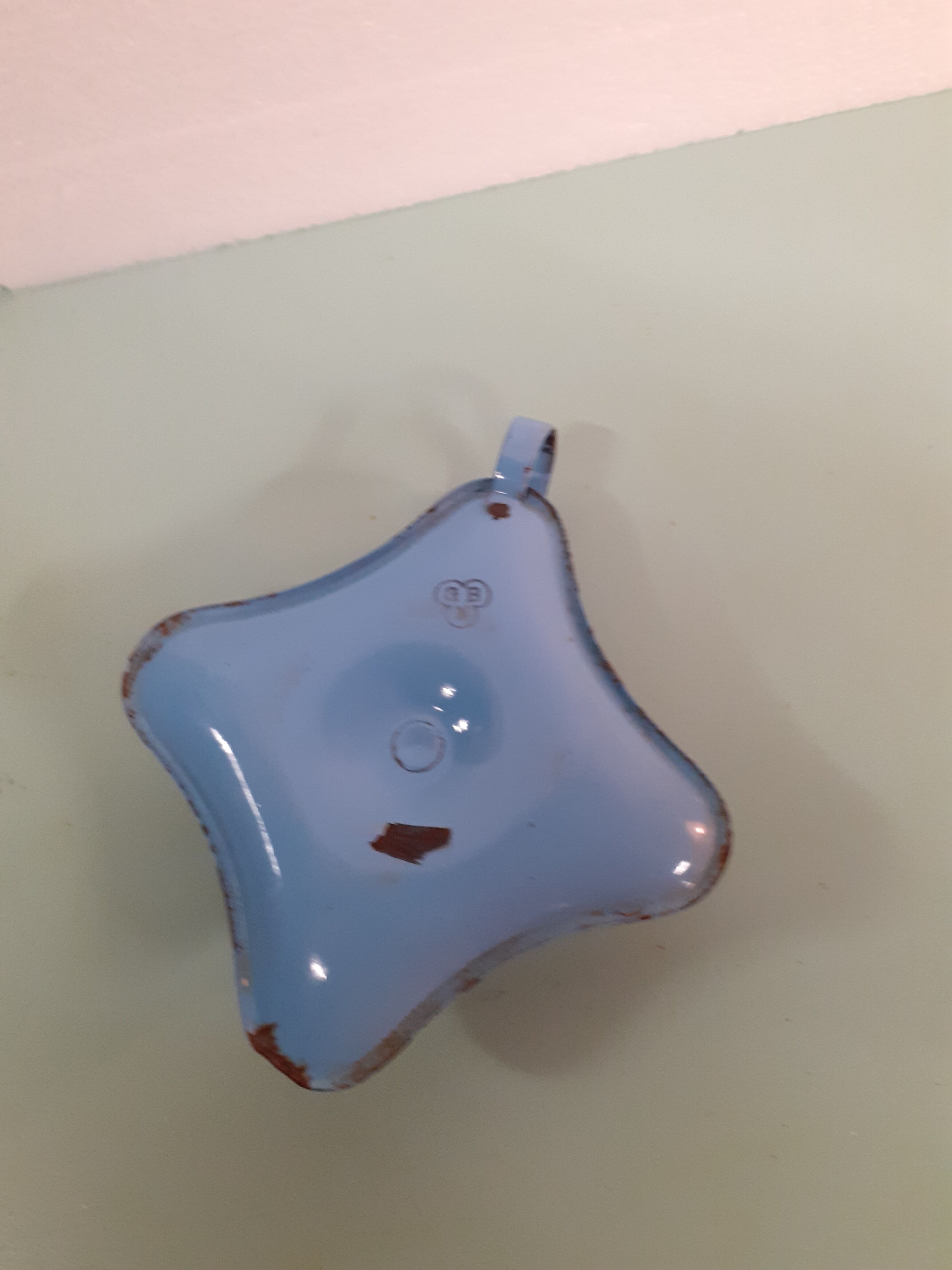 Enamelled sheet metal candlestick