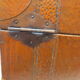 Rectangular wooden suitcase covered with leather