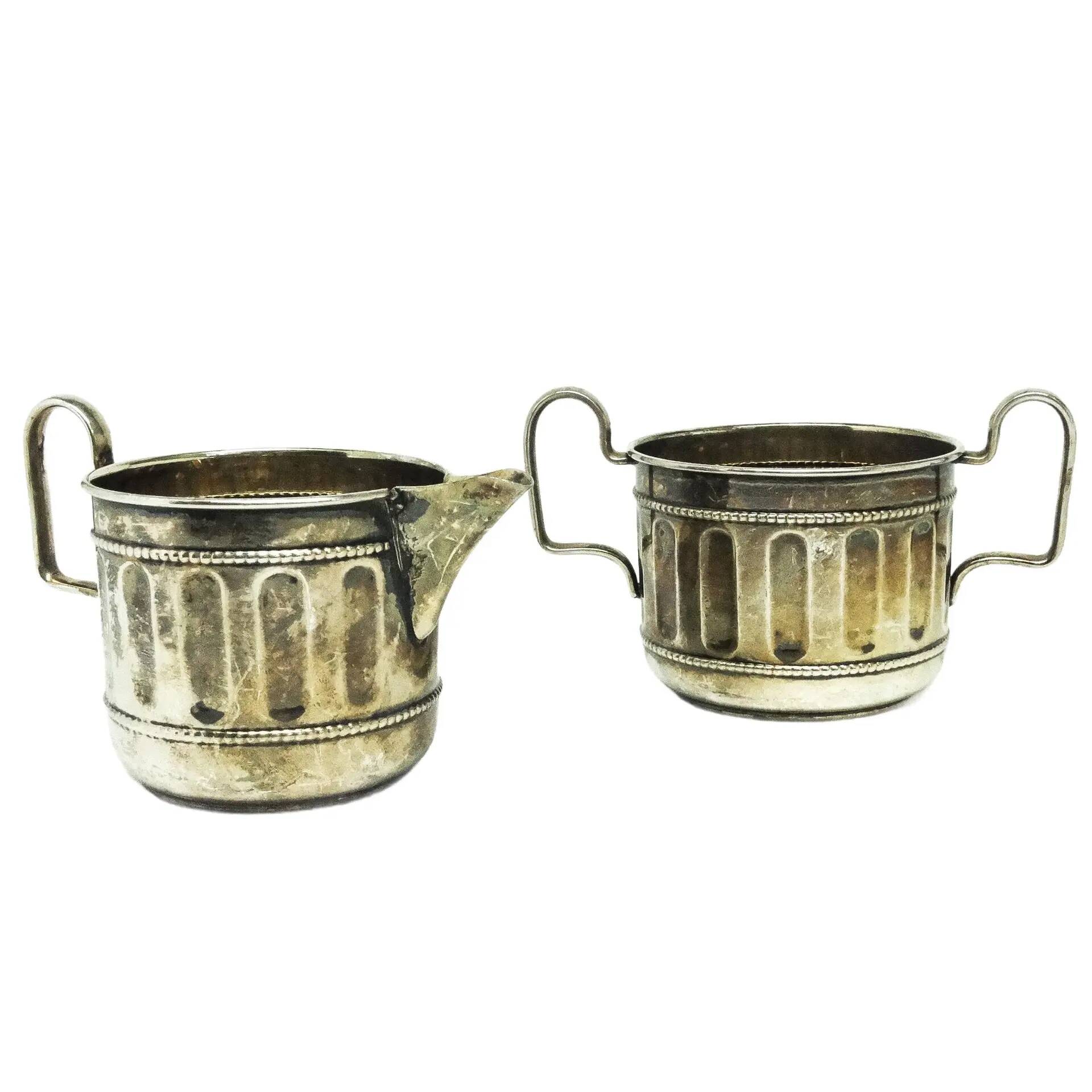 Set of sugar bowl and milk jug, neoclassicism with art deco influences, silver-plated brass, Belgium, 1930s.