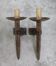 Pair of brutalist wall sconces in hammered and patinated iron, work from the years.