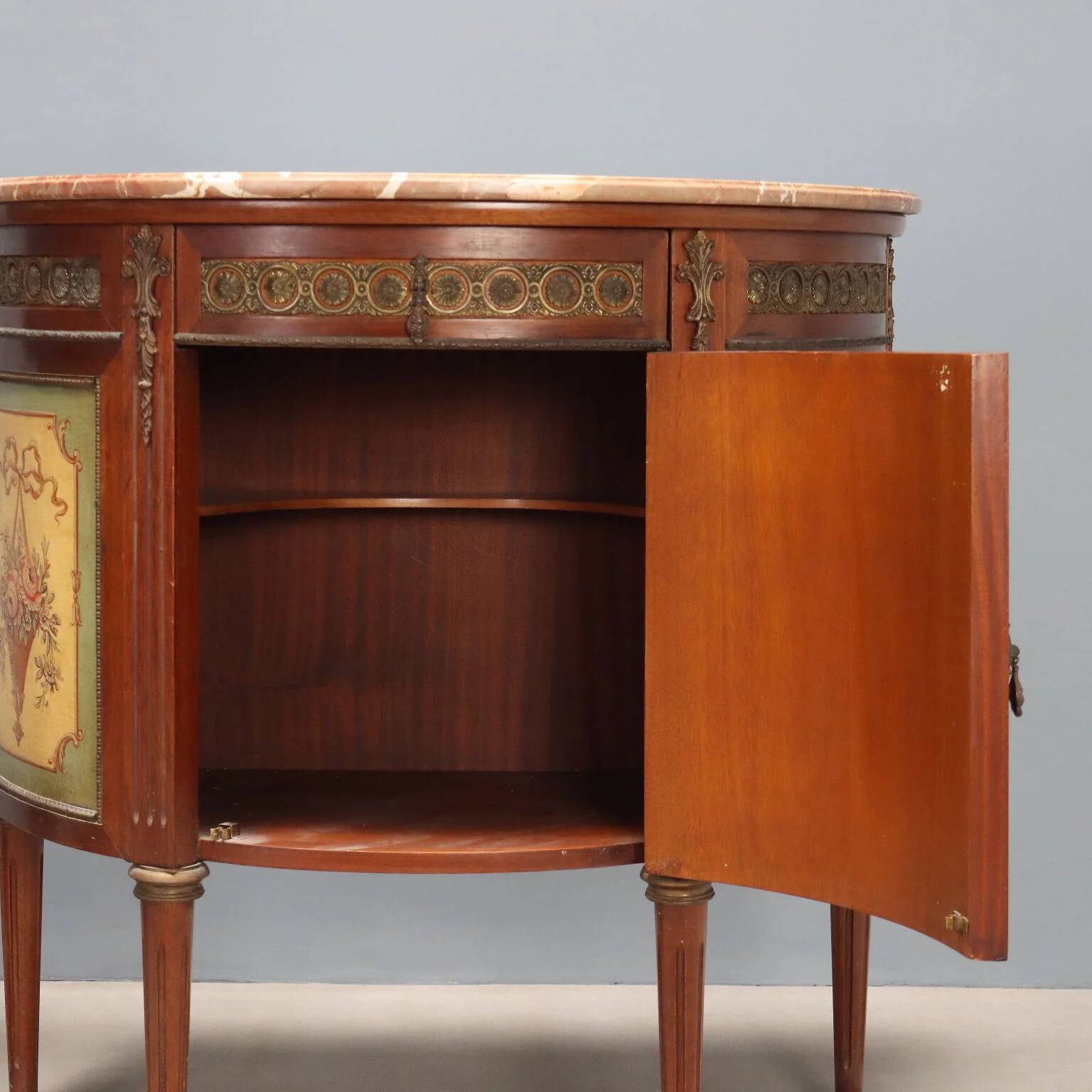 Antique demi-lune buffets in neoclassical style in mahogany from the 20th century.