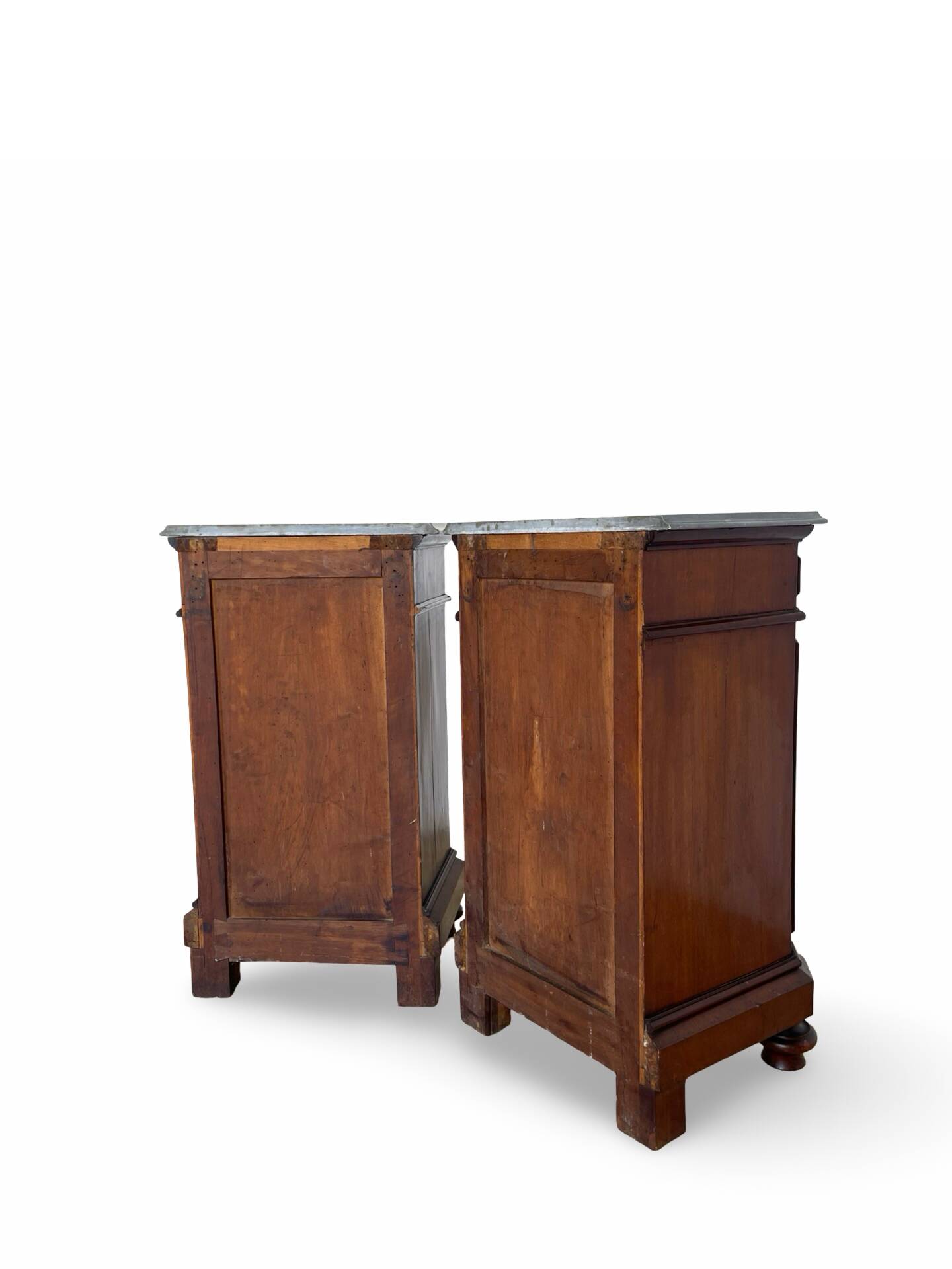 A pair of antique walnut bedside tables from the 1890s.