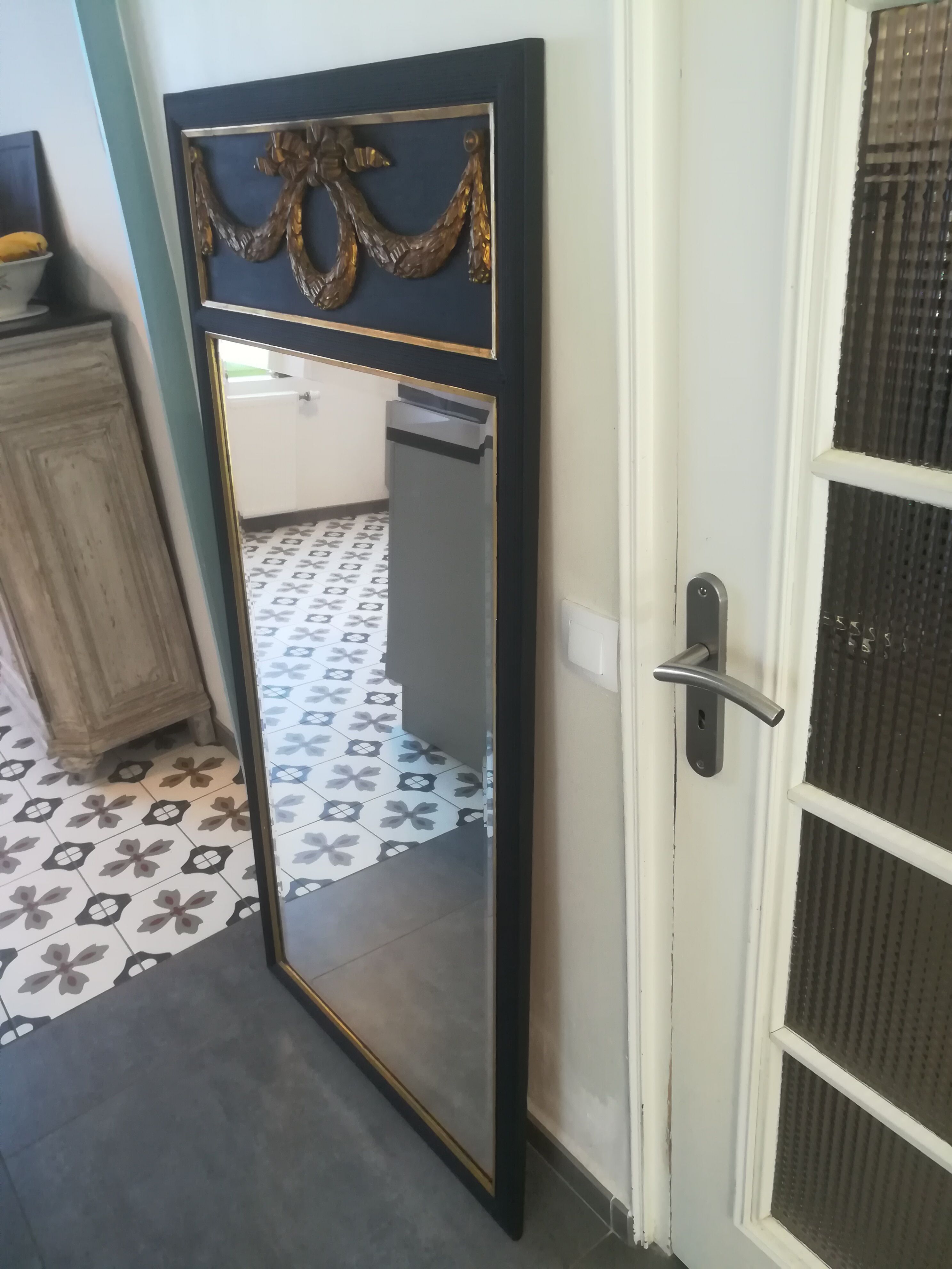 Trumeau louis XVI style mirror in black and gold stucco