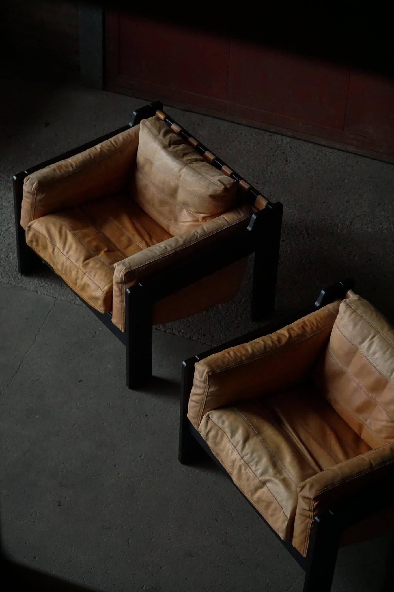 Pair of wooden and leather armchairs by Rud Thygesen & Johnny Sørensen, 1970s.