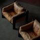 Pair of wooden and leather armchairs by Rud Thygesen & Johnny Sørensen, 1970s.