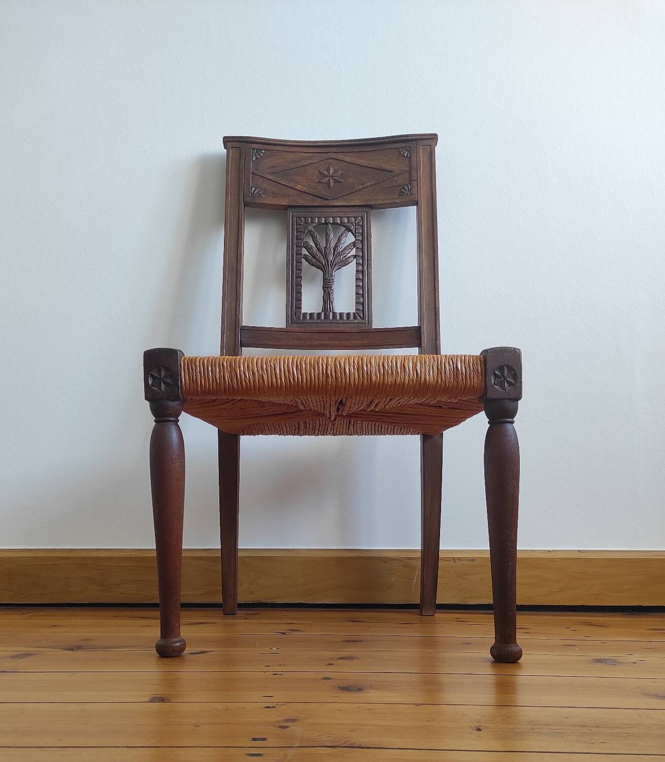 Armchair, low carved chair from the 19th century - decorated with wheat ears.