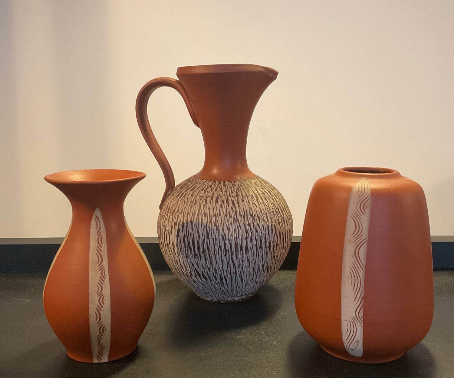 Series of 3 vintage chiseled terracotta vases