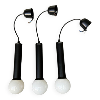 3 black pendant lights by designer Tapio Wirkkala