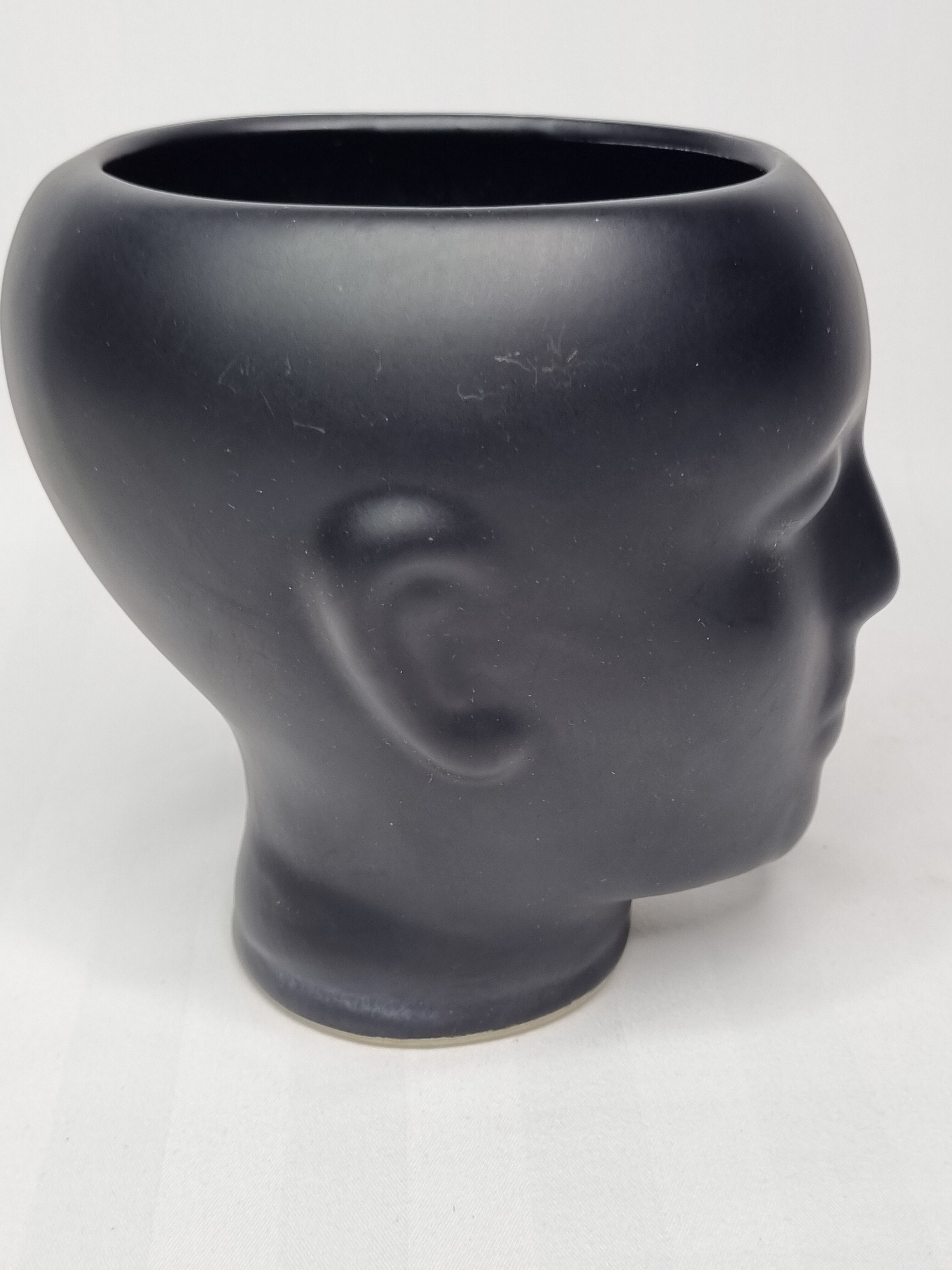 Anthropomorphic pot cover in matt black glazed ceramic, 80s