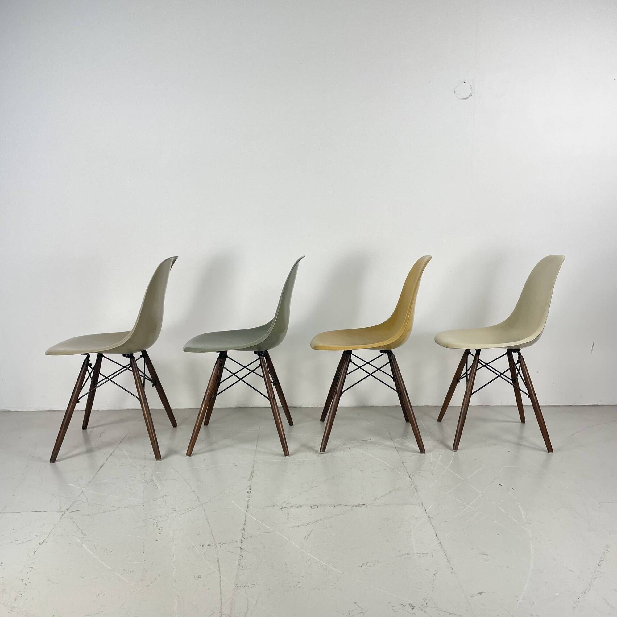 Eames Herman Miller DSW side chairs in greige, seafoam green, light ochre and parchment with slight