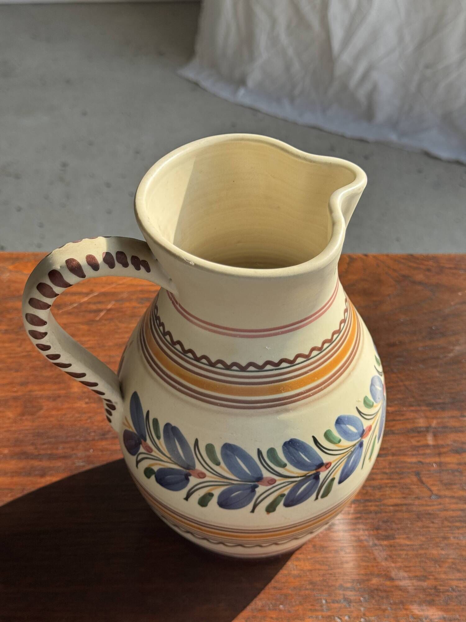 Beige carafe with stylized blue flower friezes