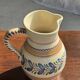 Beige carafe with stylized blue flower friezes