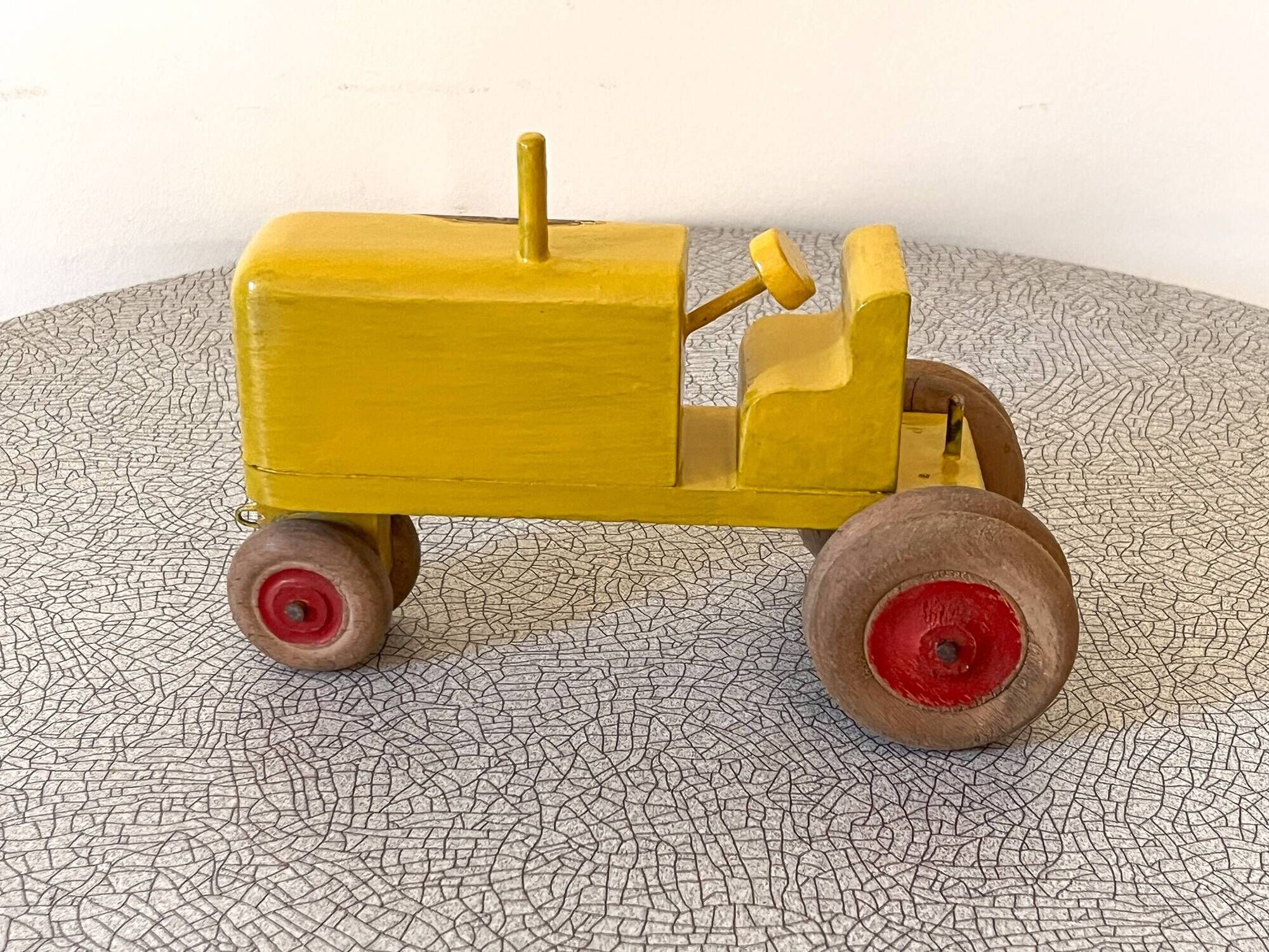 Wooden tractor from the French brand "Ateliers du Père Noël"