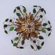 Flower wall light, gilded metal and glass cabochons, attributed to Baguès.
