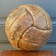 Mid-20th century leather soccer ball with visible stitching and beautiful patina