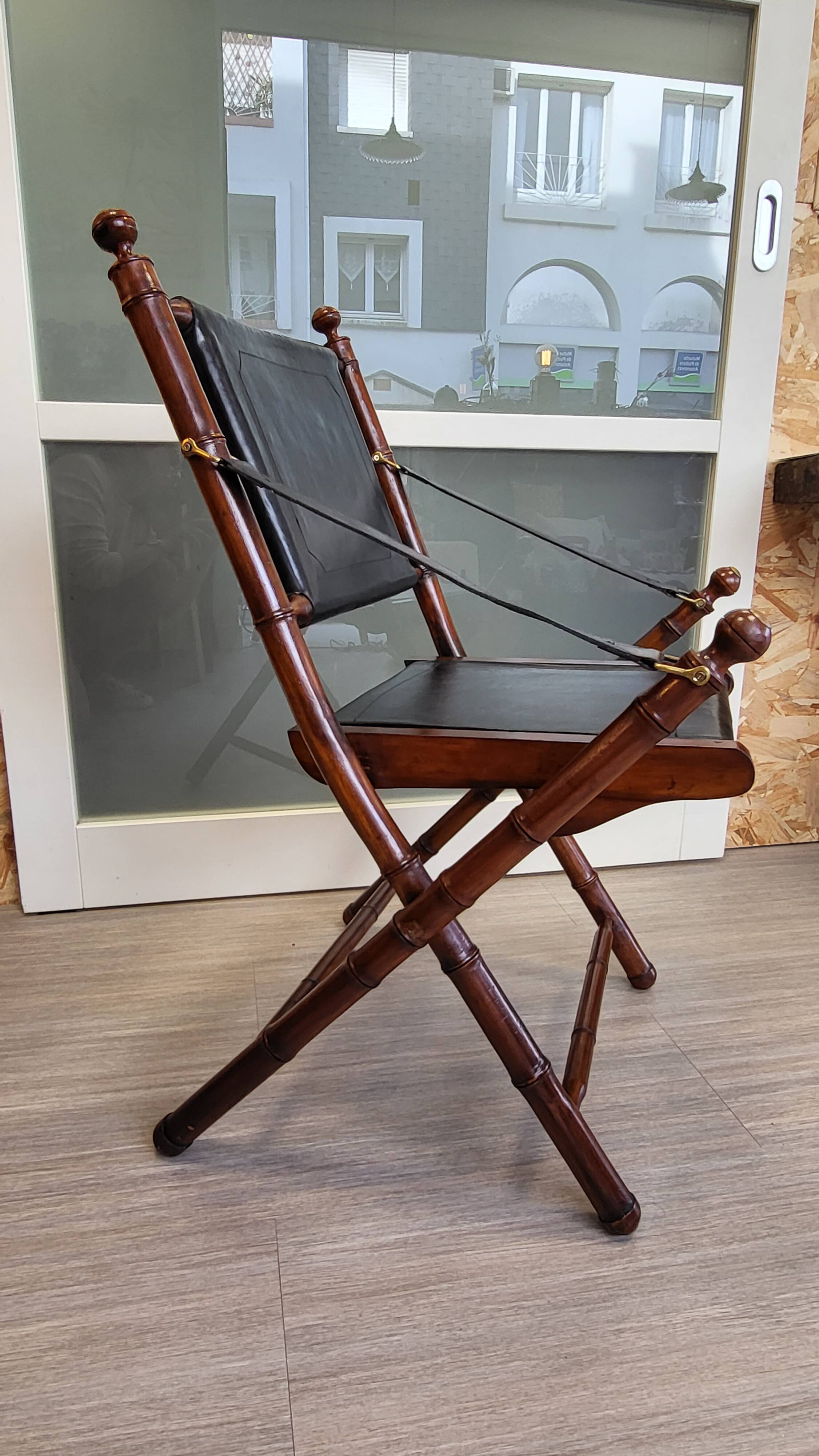 Colonial style folding leather and teak armchair