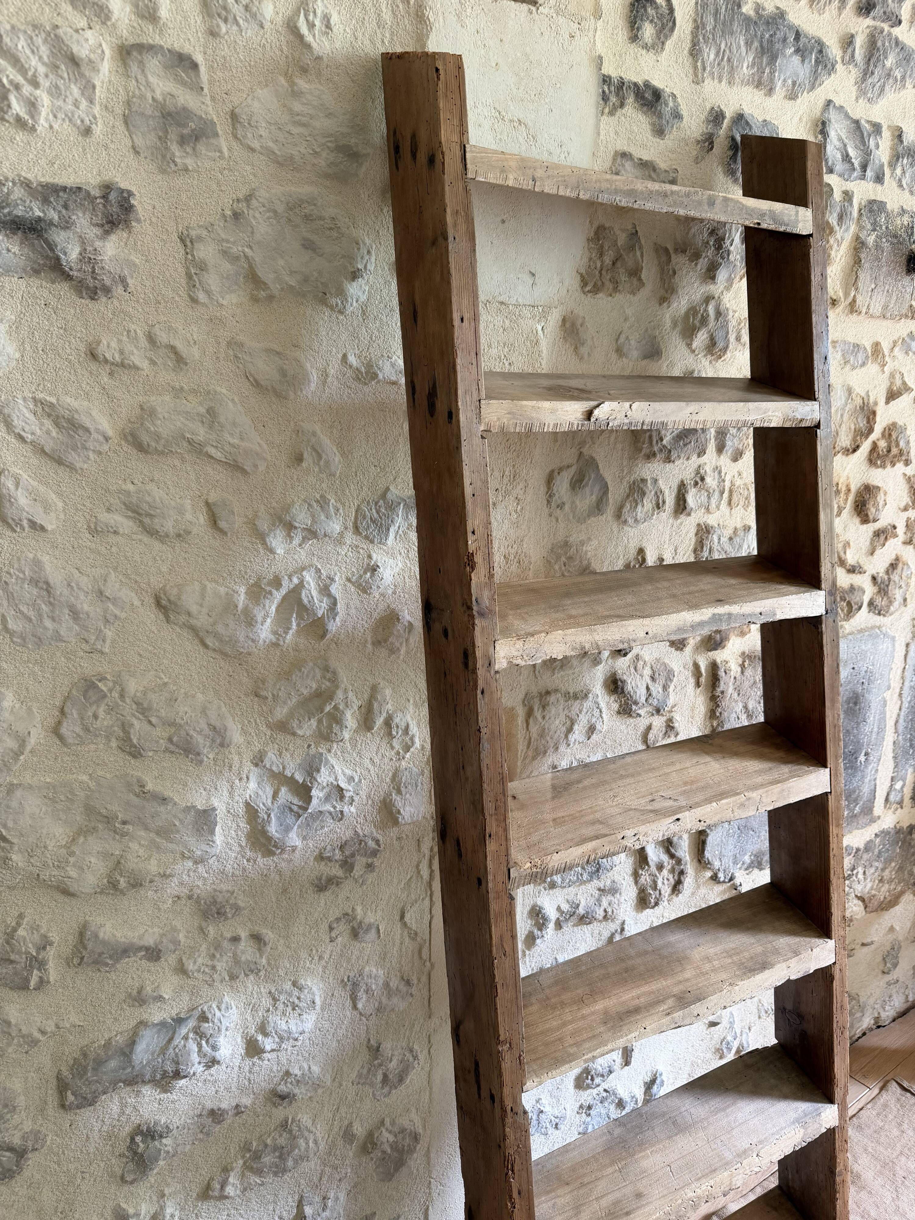 Decorative wooden ladder or towel rack.