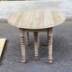 Round extendable dining table with flaps, stripped in raw oak, with 3 extensions.