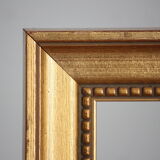 Carved and moulded gilded wood frame