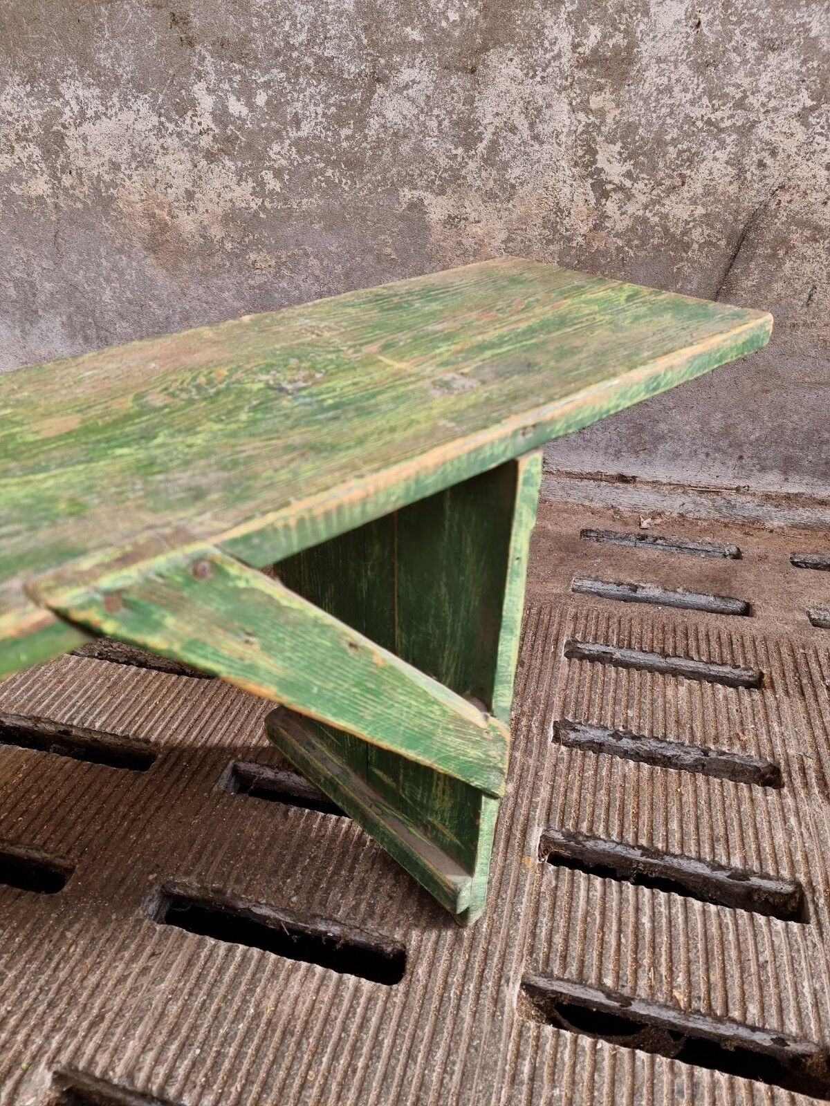 Old wooden bench side table grass green
