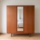 Vintage 1950s wooden wardrobe with mirror.