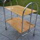 Folding dessert trolley on chrome metal wheels and formica.