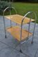 Folding dessert trolley on chrome metal wheels and formica.