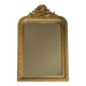 Golden mirror with a pediment from the early 20th century.