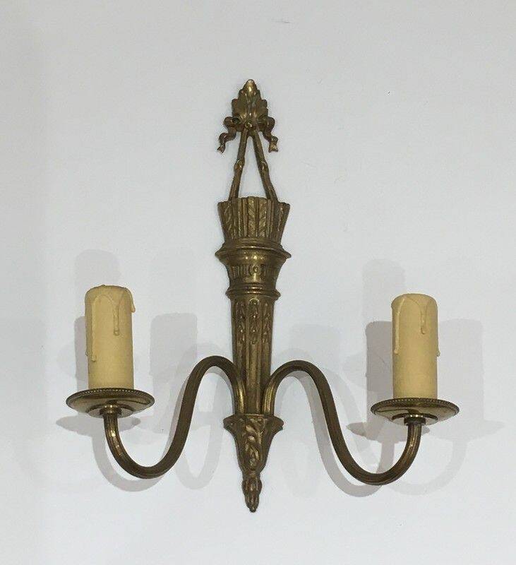 Pair of Louis XVI style bronze wall sconces with quivers and ribbons