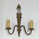 Pair of Louis XVI style bronze wall sconces with quivers and ribbons