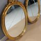 Paire de miroirs oval  doré vintage