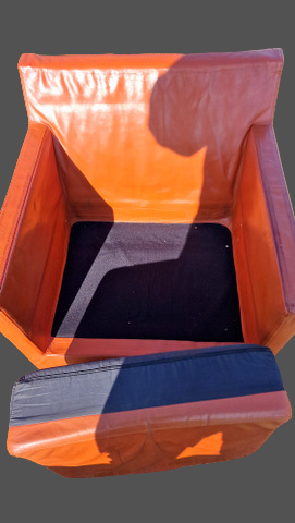 Pair of vintage orange leather armchairs